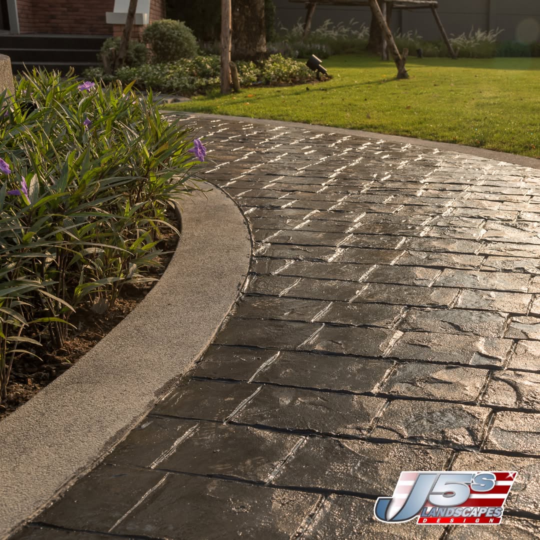 Travertine and stamped pavers by J5's Landscape Design
